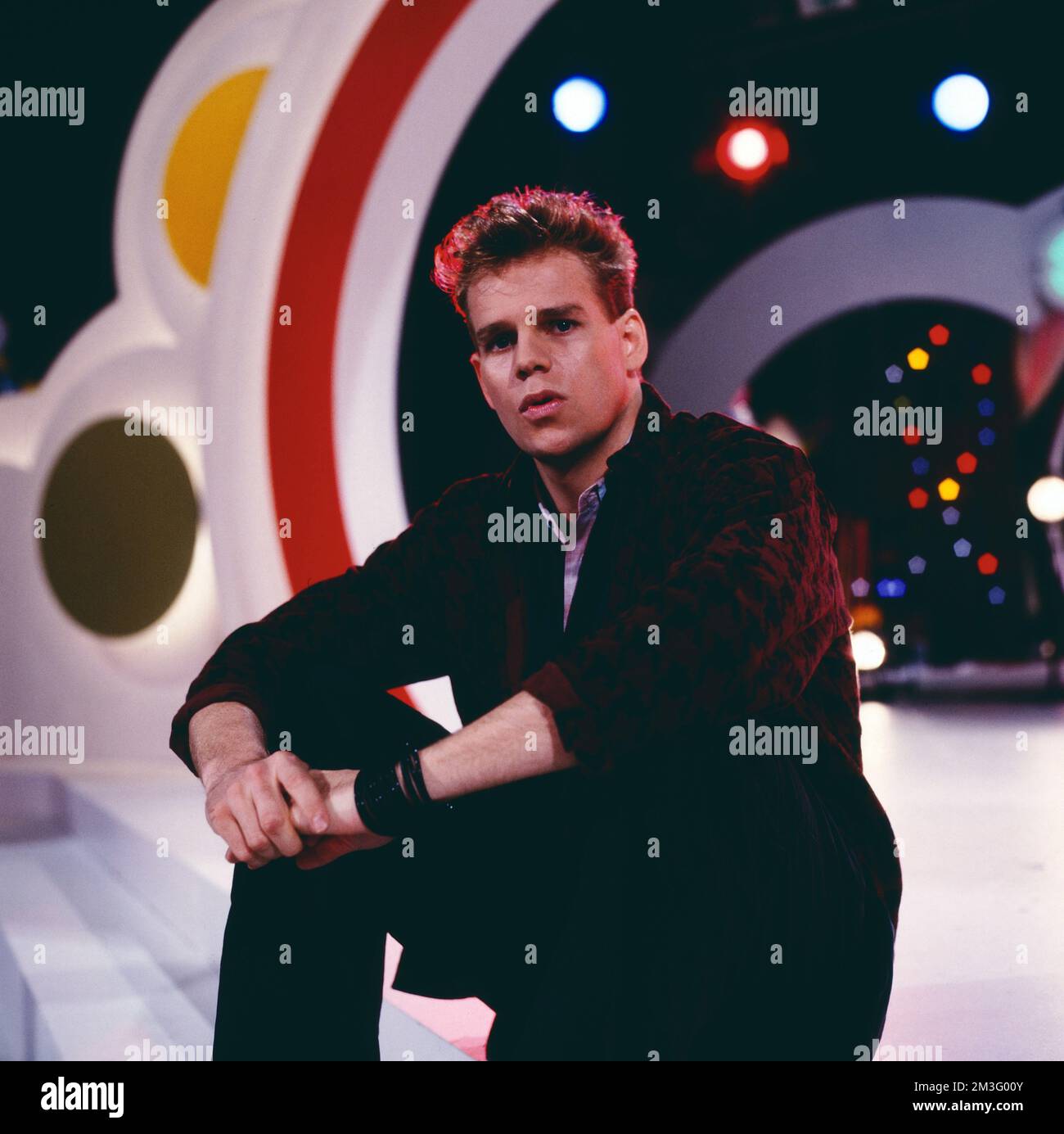 Die Spiebude, ARD Spielshow, Deutschland, 1984, mit Al Corley, amerikanischer Schauspieler und Sänger. Spielbude, TV music show, Germany, 1984, with Al Corley, American actor and singer. Stock Photo