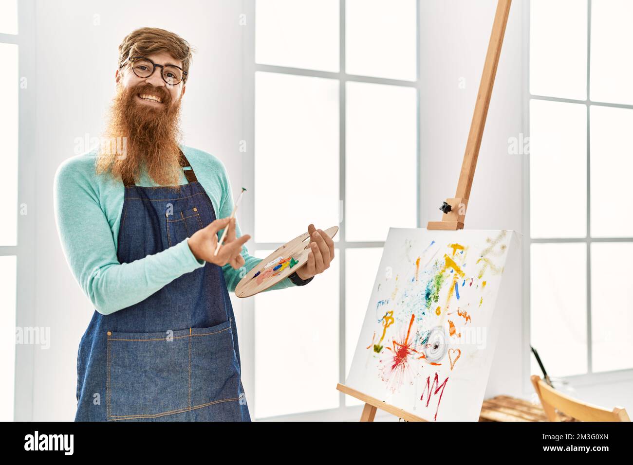 Smiling redhead man painting hi-res stock photography and images - Alamy