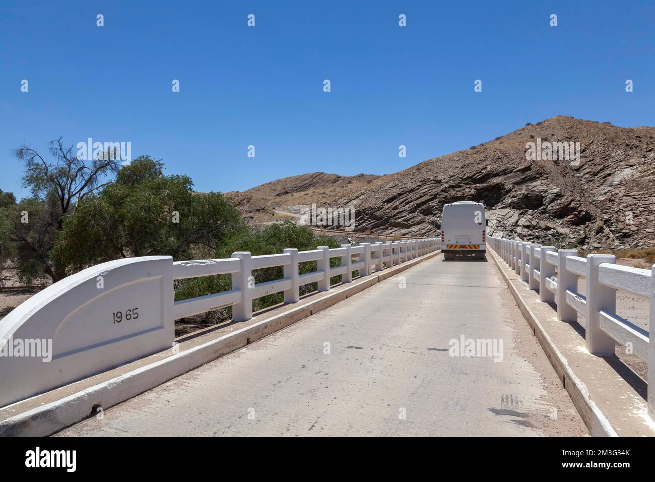 Coach crossing a bridge over the Kuiseb River, C14 on the road, Namibia Stock Photo