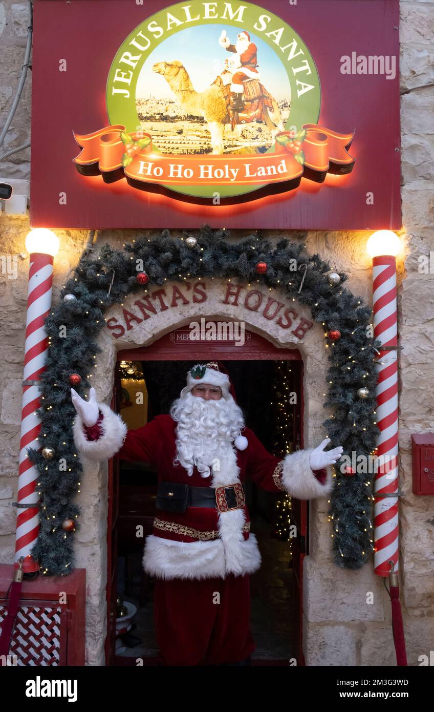 Issa Kassissieh an Arab Orthodox Christian and Israel’s only certified Santa Claus stands at the doorway of his Santa's House during Christmas in the Christian Quarter old city of Jerusalem Israel Stock Photo