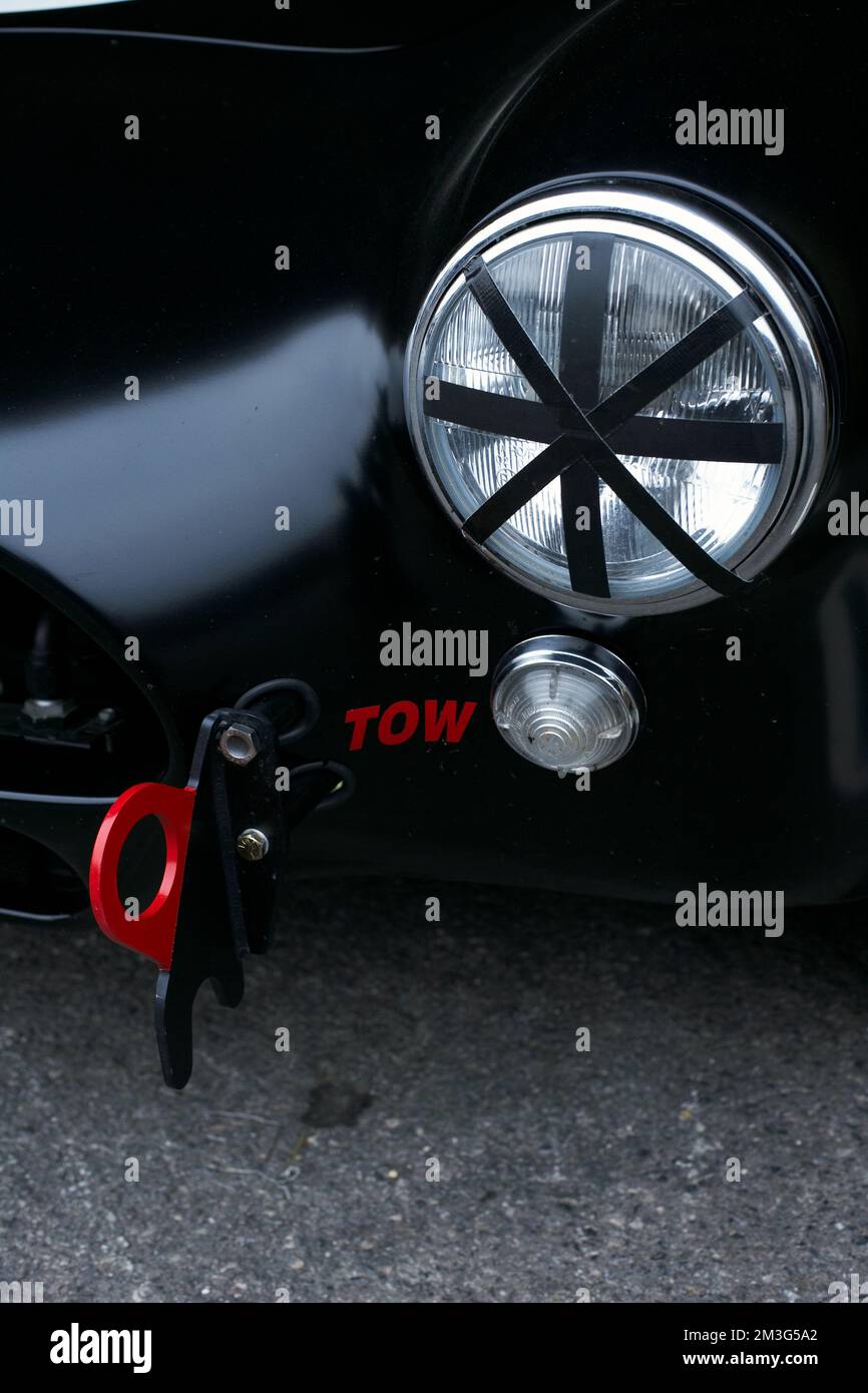 Close up of red towing hook at sports car Stock Photo