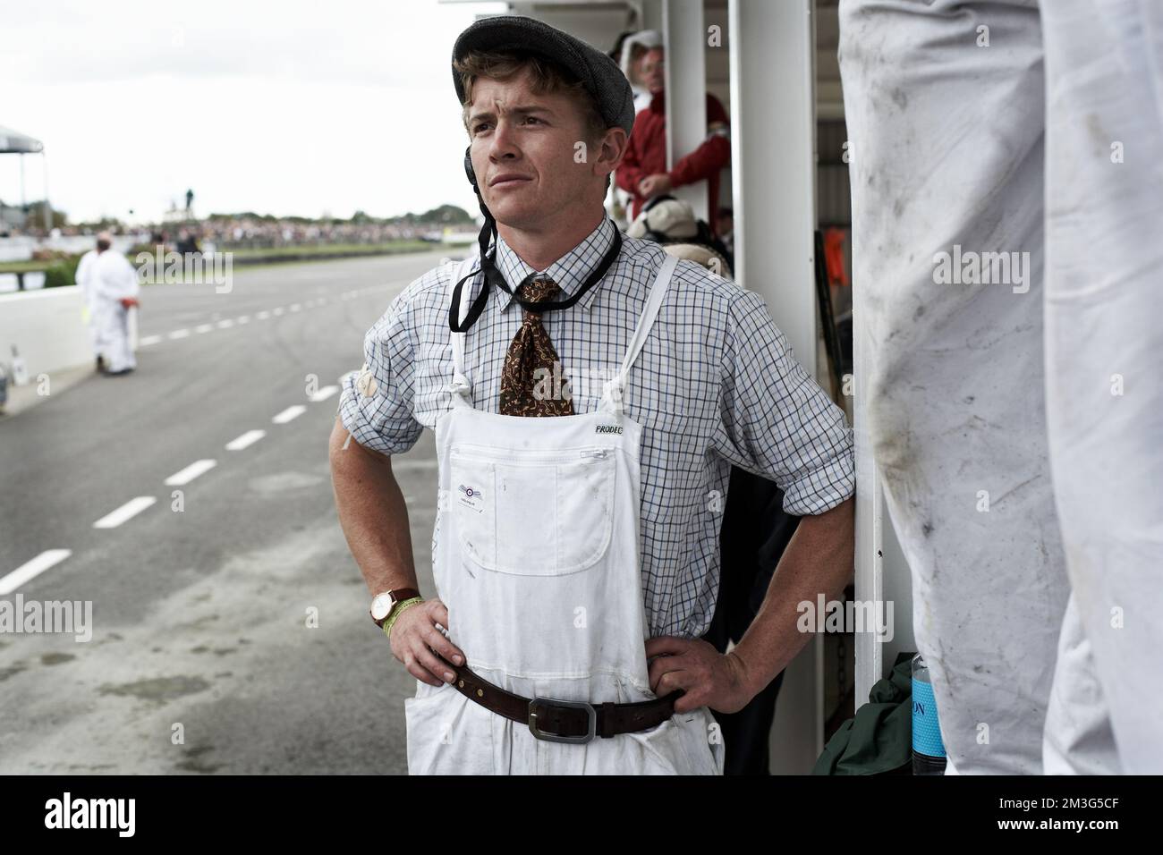 West Sussex, England Mechanic watching the race in the paddock at the