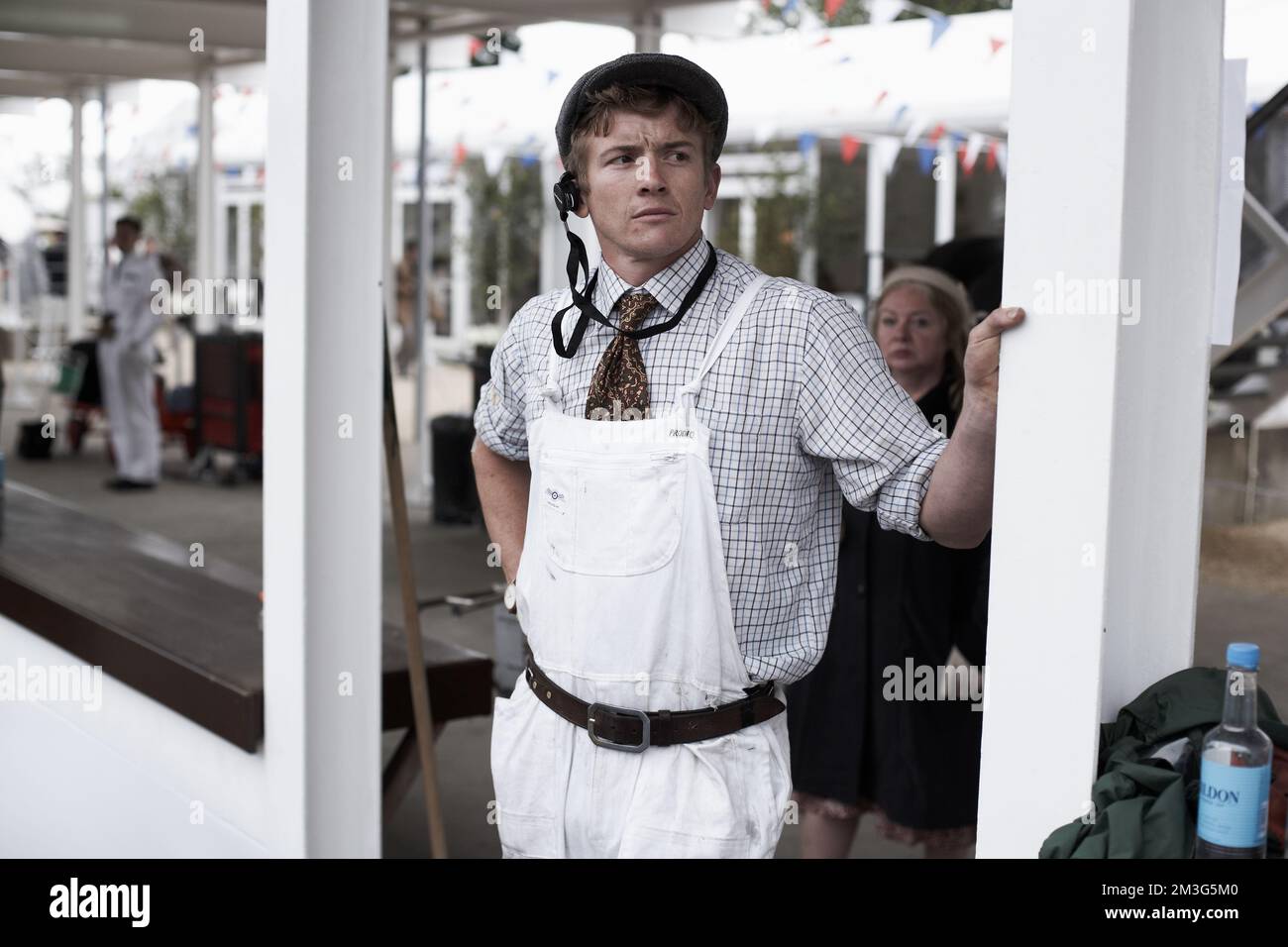 West Sussex, England Mechanic watching the race in the paddock at the