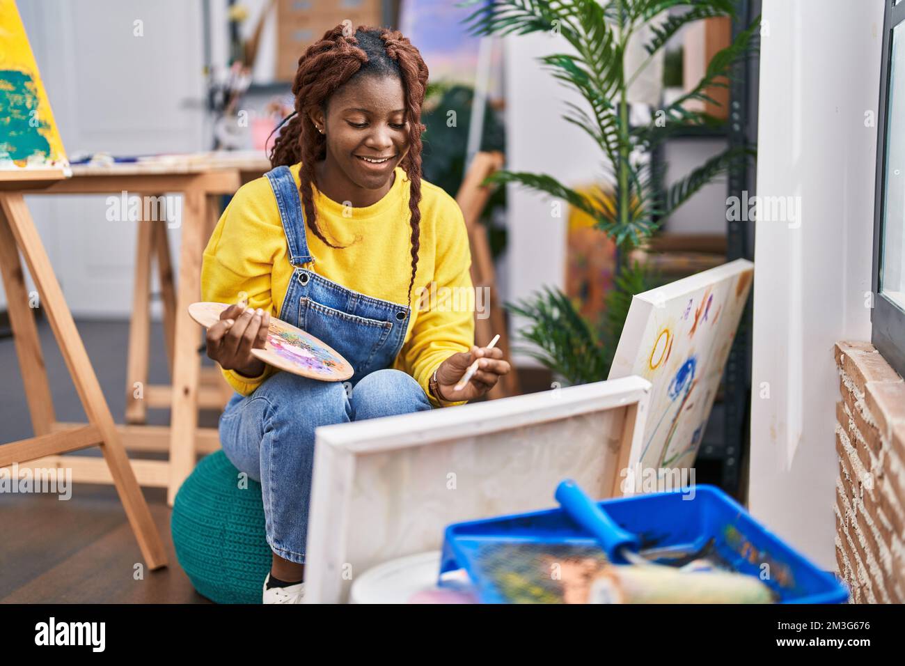 African american woman artist smiling confident drawing at art studio ...