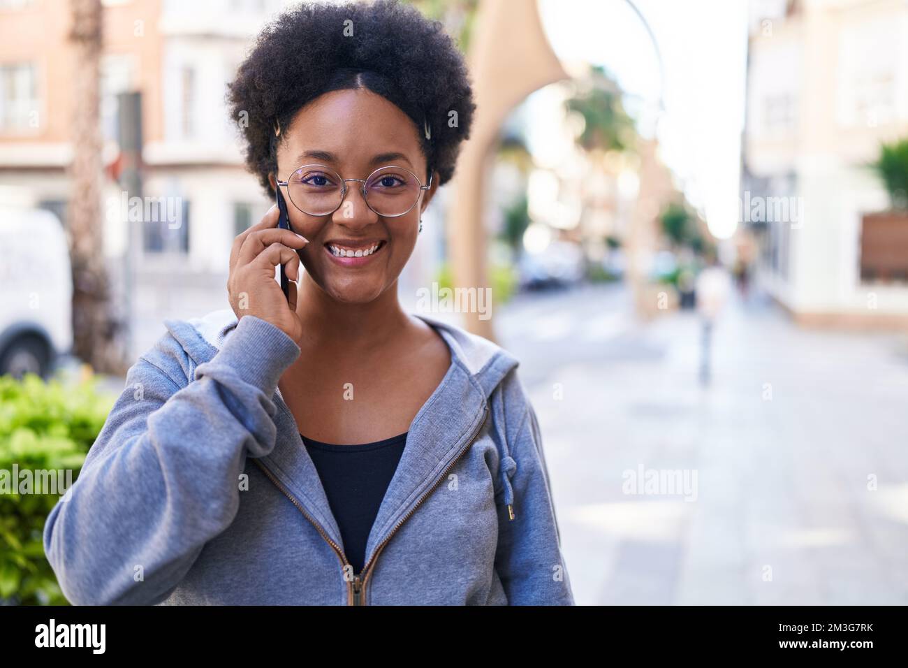 African american woman smiling confident talking on the smartphone at ...