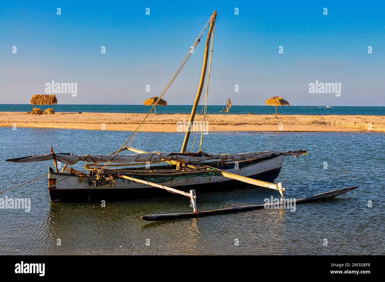 Little sailing boat on a sand tongue below the Antsanitia beach resort ...