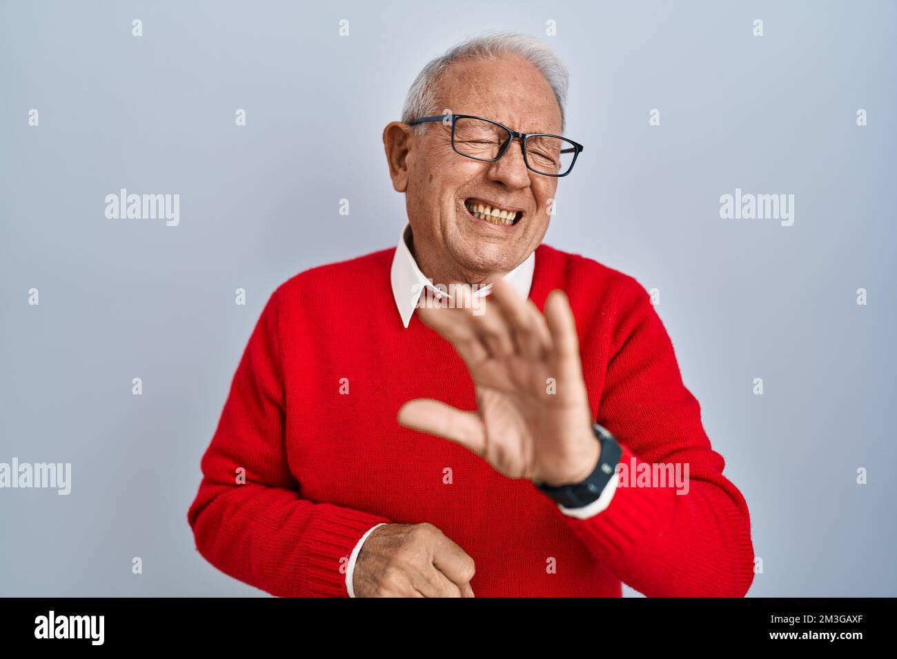 Senior man with grey hair standing over isolated background disgusted ...