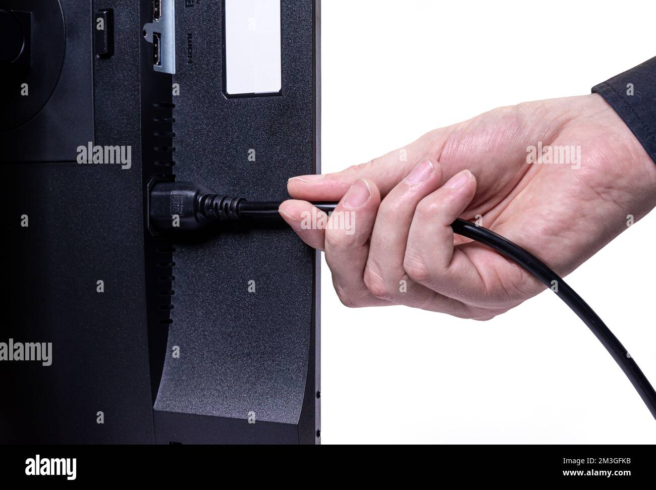 IT engineer Man hand inserts cable into monitor. Man hand connecting the DVI cable for monitor to computer PC. VGA DVI DisplayPort and power cable. cl Stock Photo