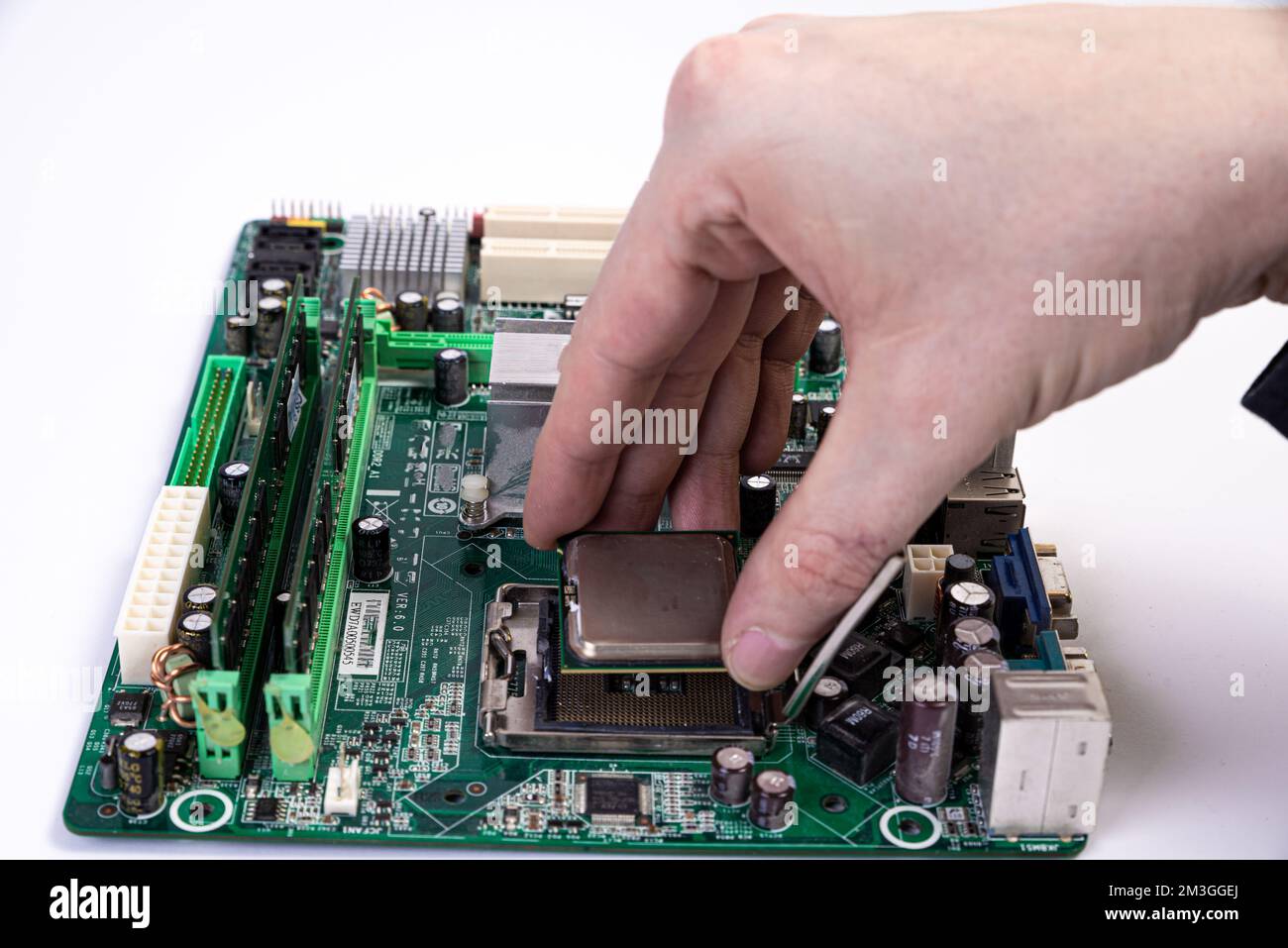 Engineer repairman holding hands in black gloves chip processor, CPU to