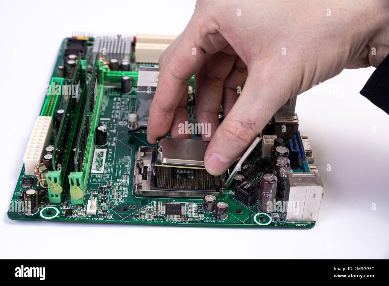 Engineer repairman holding hands in black gloves chip processor 