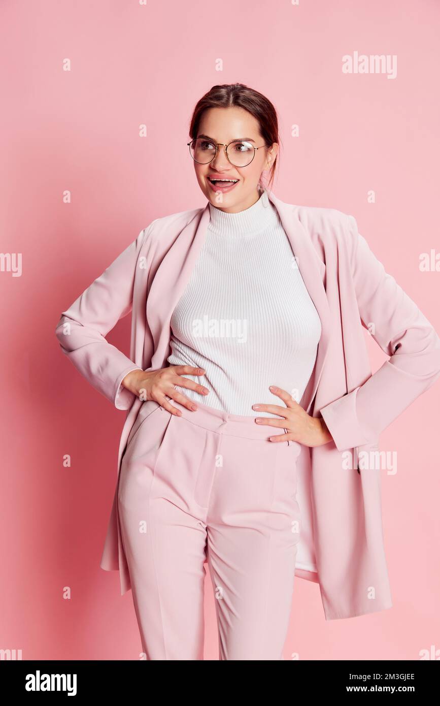 Portrait of beautiful young girl, business woman in suit and glasses ...