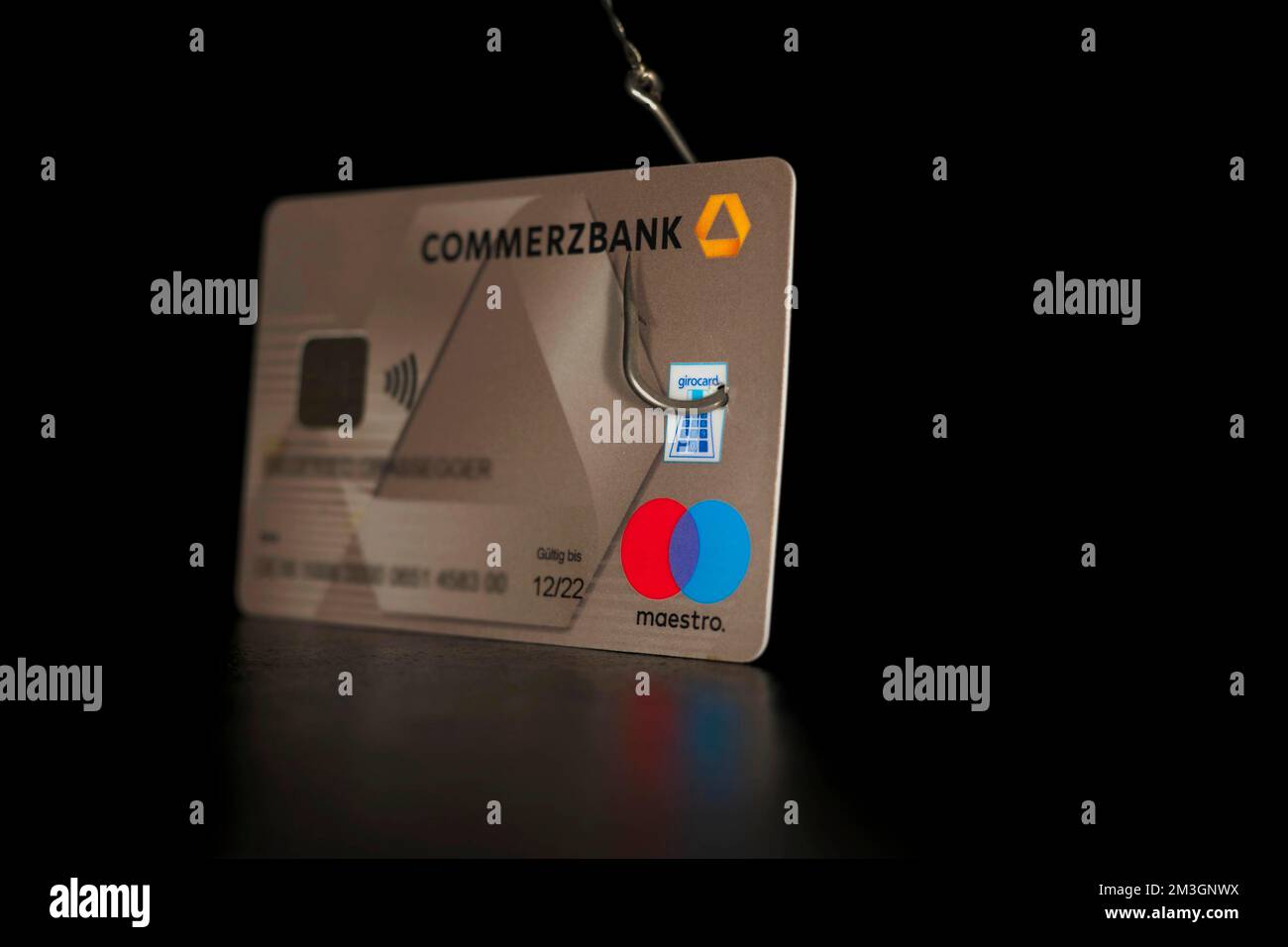 Bank data phishing symbol photo, bank card with fishhook, studio ...