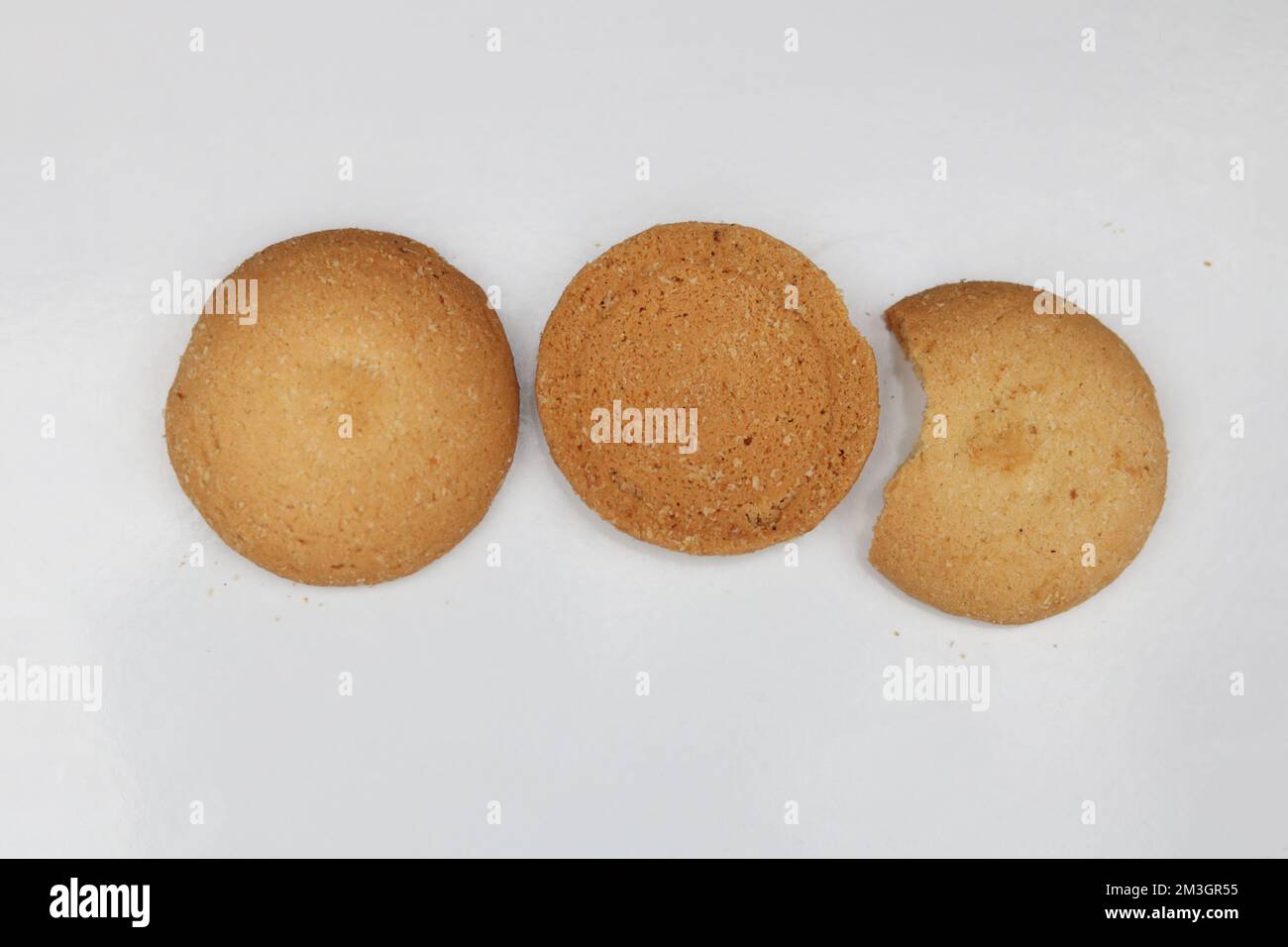 Three round biscuits half broken isolated,Cookies biscuits collection on white background. Stock Photo