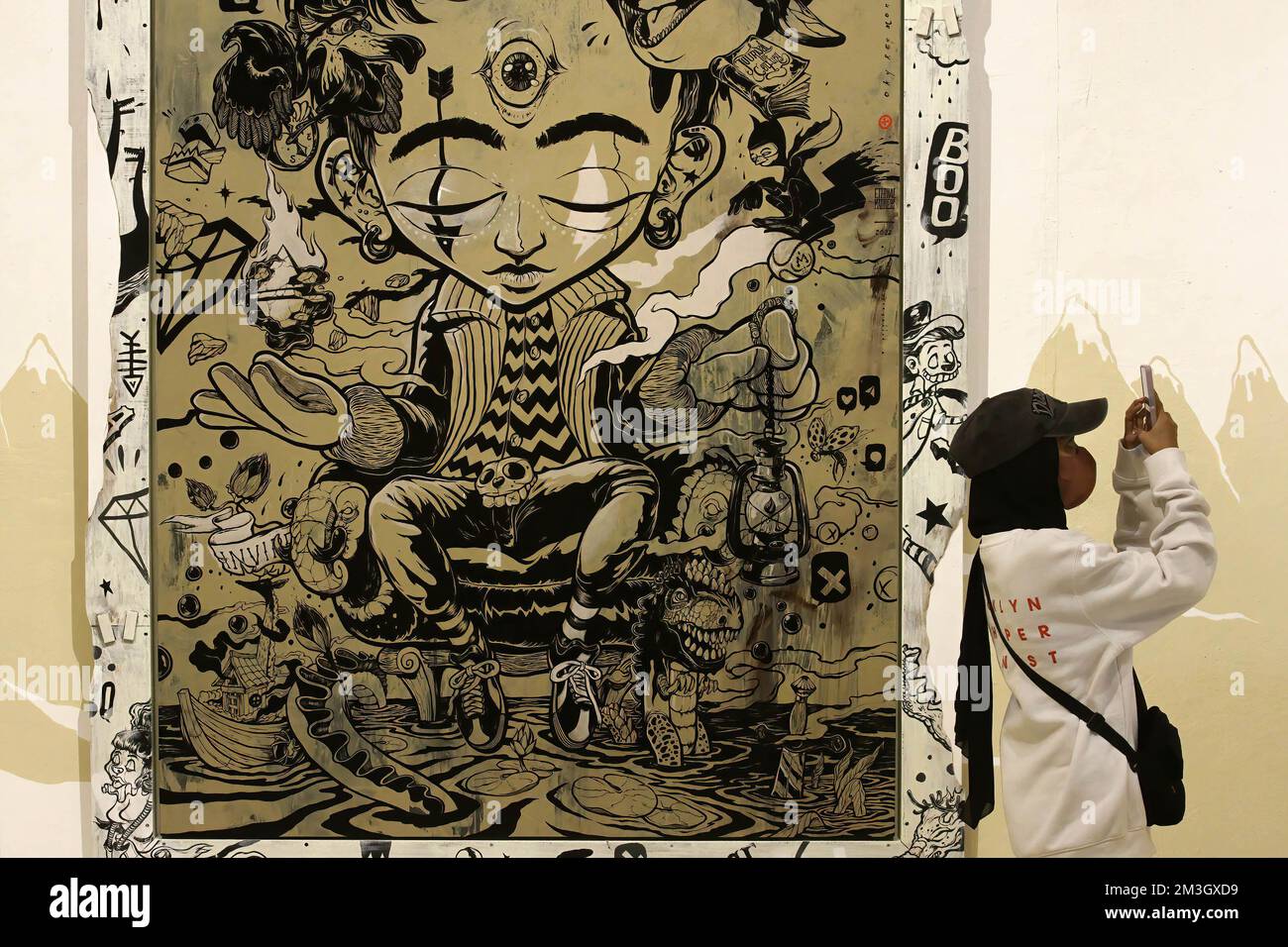 Yogyakarta, Indonesia. 15th Dec, 2022. A visitor takes photos of the