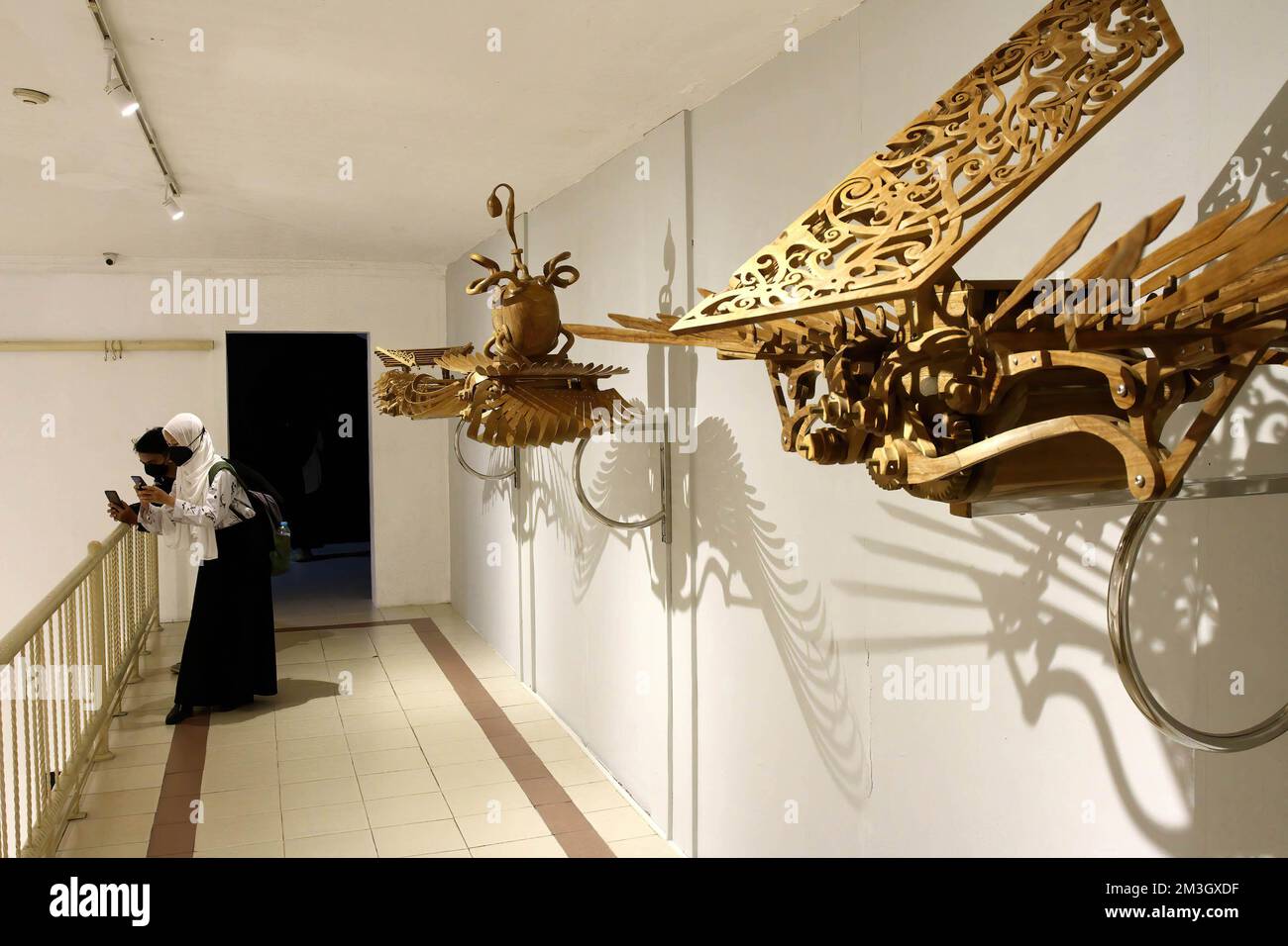 Yogyakarta, Indonesia. 15th Dec, 2022. Visitors take photos of the art