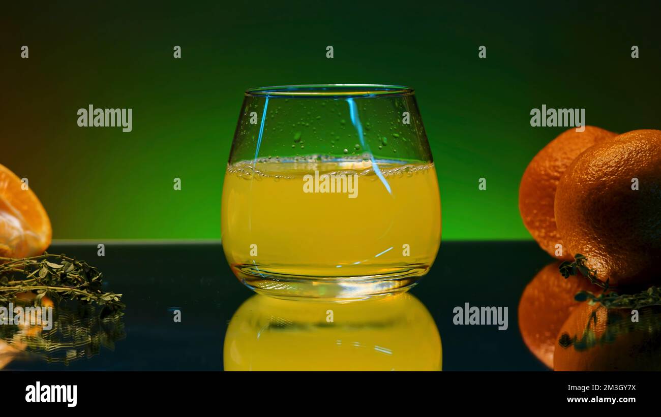 Drop falling into orange juice. Stock clip. Orange juice with alcohol