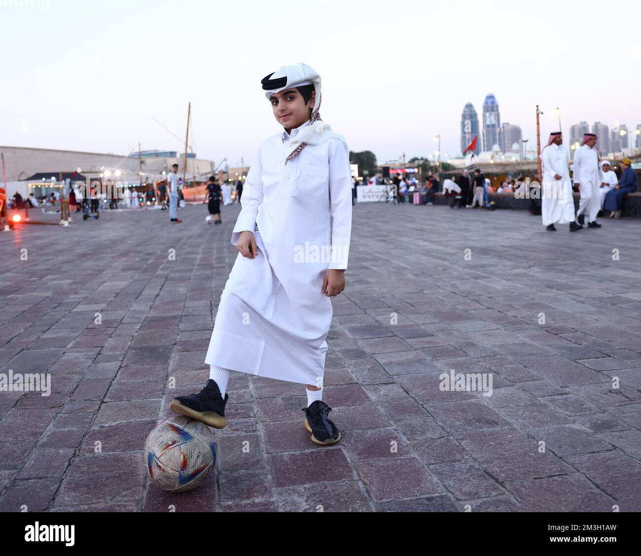 Doha, Qatar, 15th November 2022. A young boy in traditional dress poses