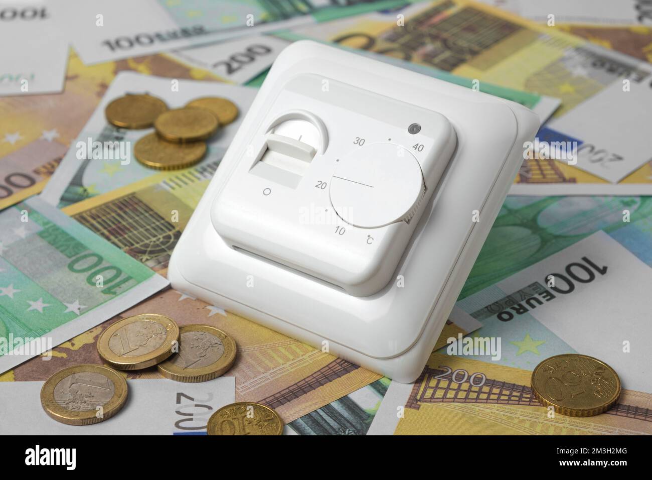 Thermostatic Valve Head on Euro Banknotes Background. Increasing