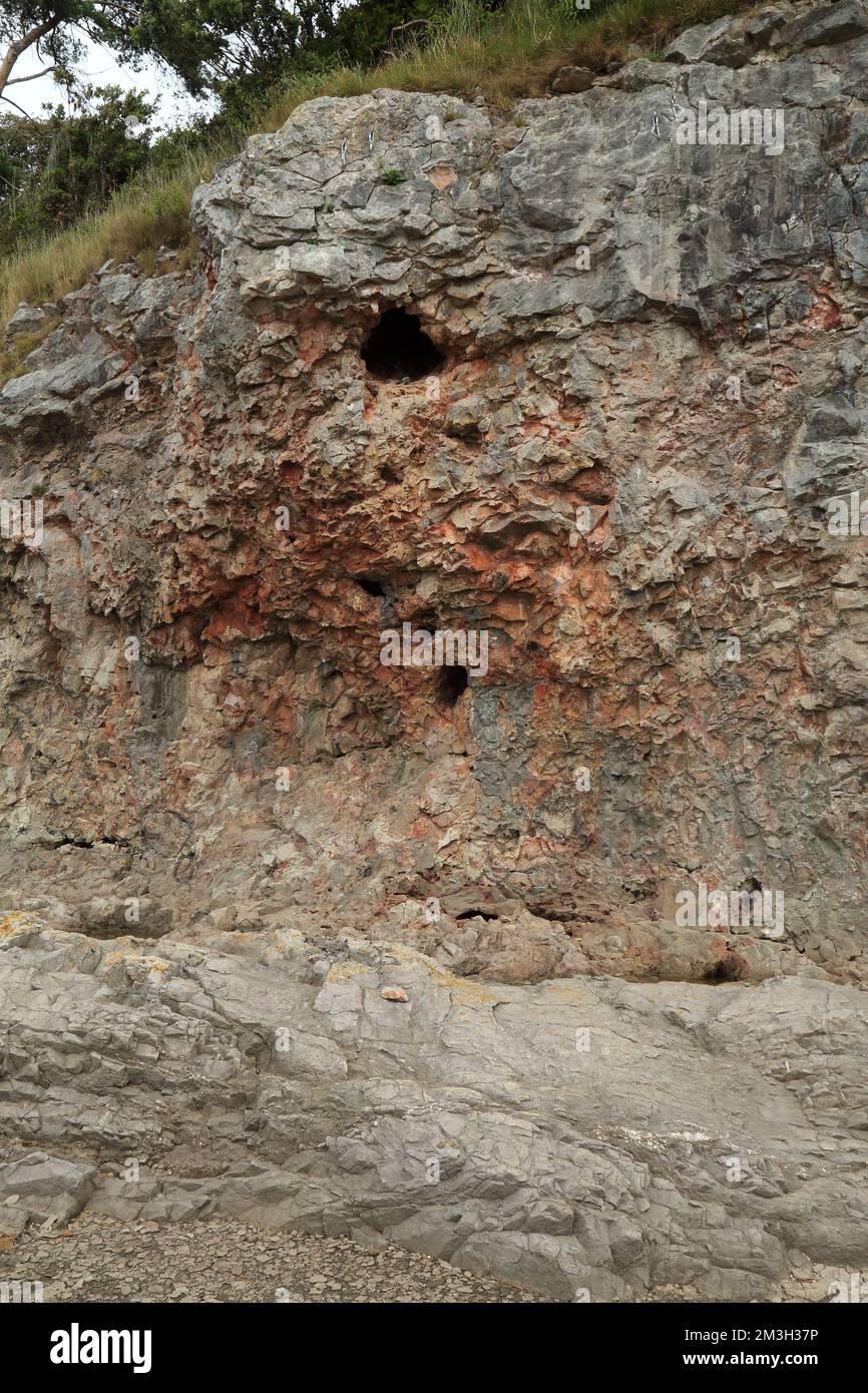 Water erosion in rock face on beach at Silverdale Cove, Silverdale ...