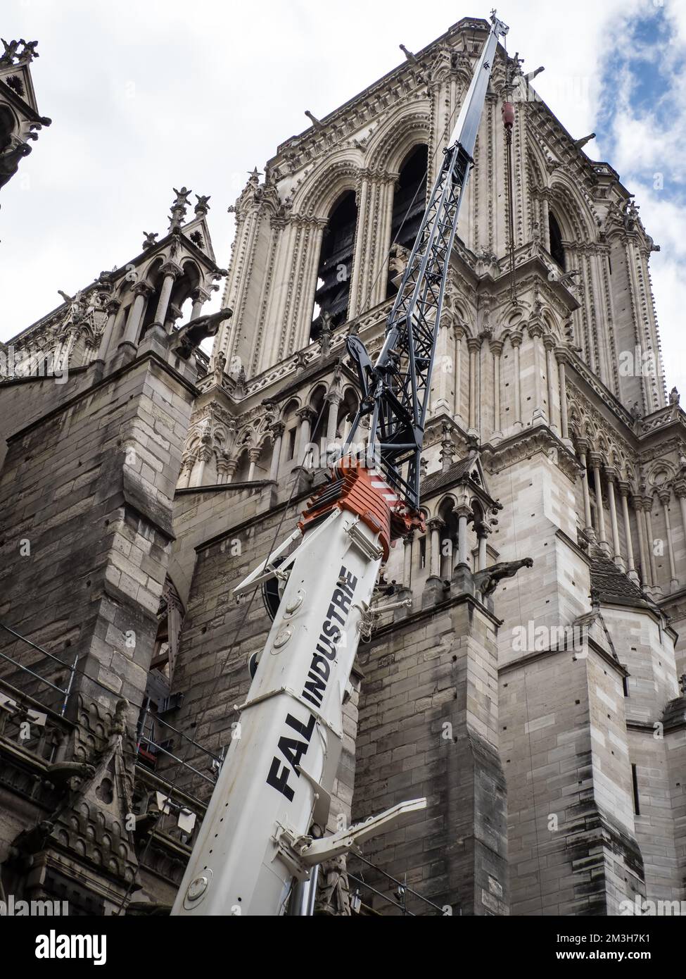 A crane working on Notre Dame Cathedral, Paris, France Stock Photo