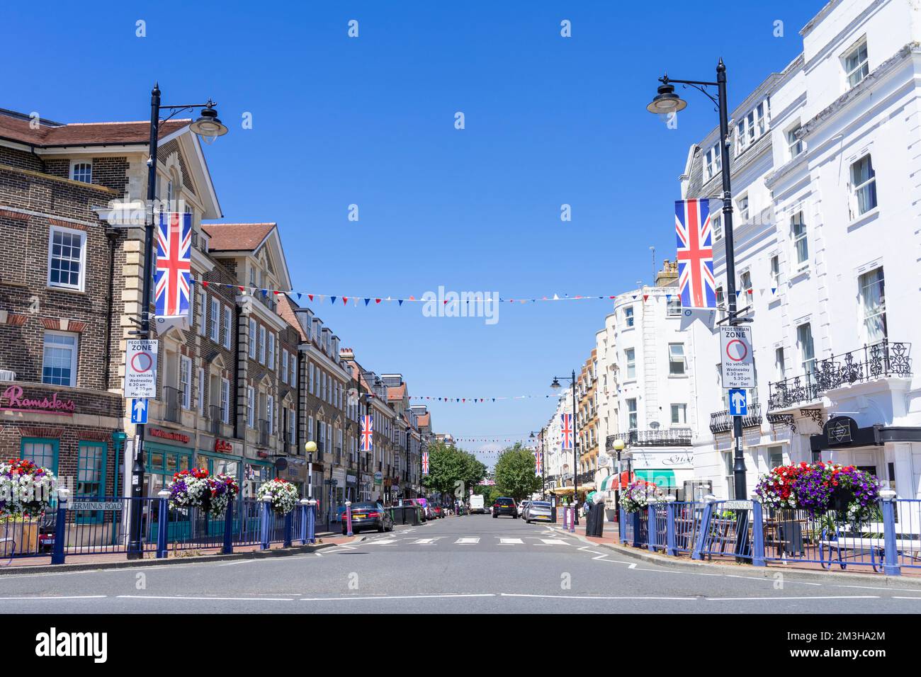 Eastbourne East Sussex Eastbourne Terminus road shops and restaurants with Union flags flying Eastbourne town centre Eastbourne  England UK GB Europe Stock Photo