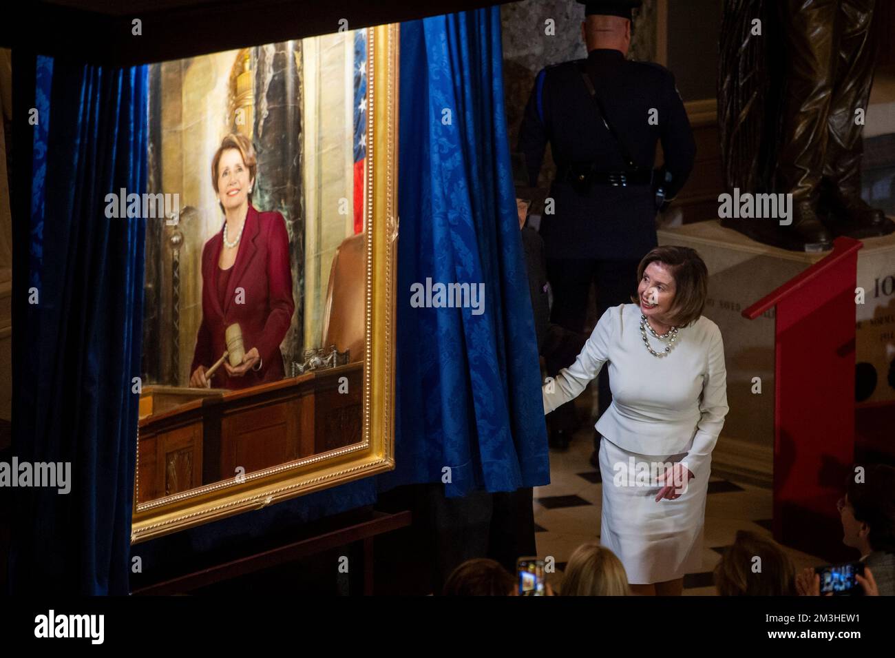 Washington, United States Of America. 14th Dec, 2022. Speaker of the United States House of Representatives Nancy Pelosi (Democrat of California) is joined by her husband Paul Pelosi as she draws back the curtain to unveil her official portrait in Statuary Hall at the US Capitol in Washington, DC, Wednesday, December 14, 2022. Credit: Rod Lamkey/CNP/Sipa USA Credit: Sipa USA/Alamy Live News Stock Photo