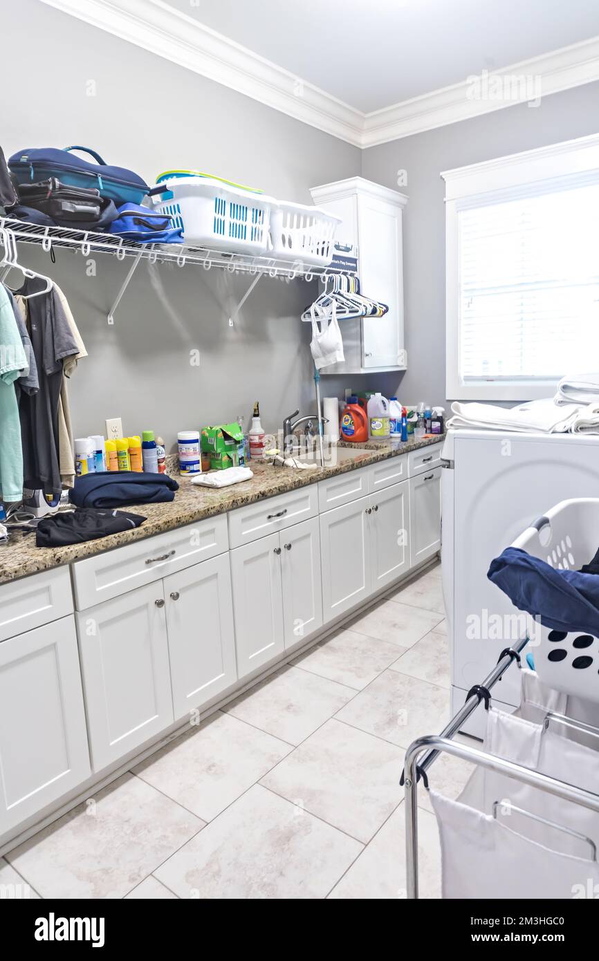 Cleaning supplies and tools on shelves and cabinets in pantry room Stock  Photo - Alamy