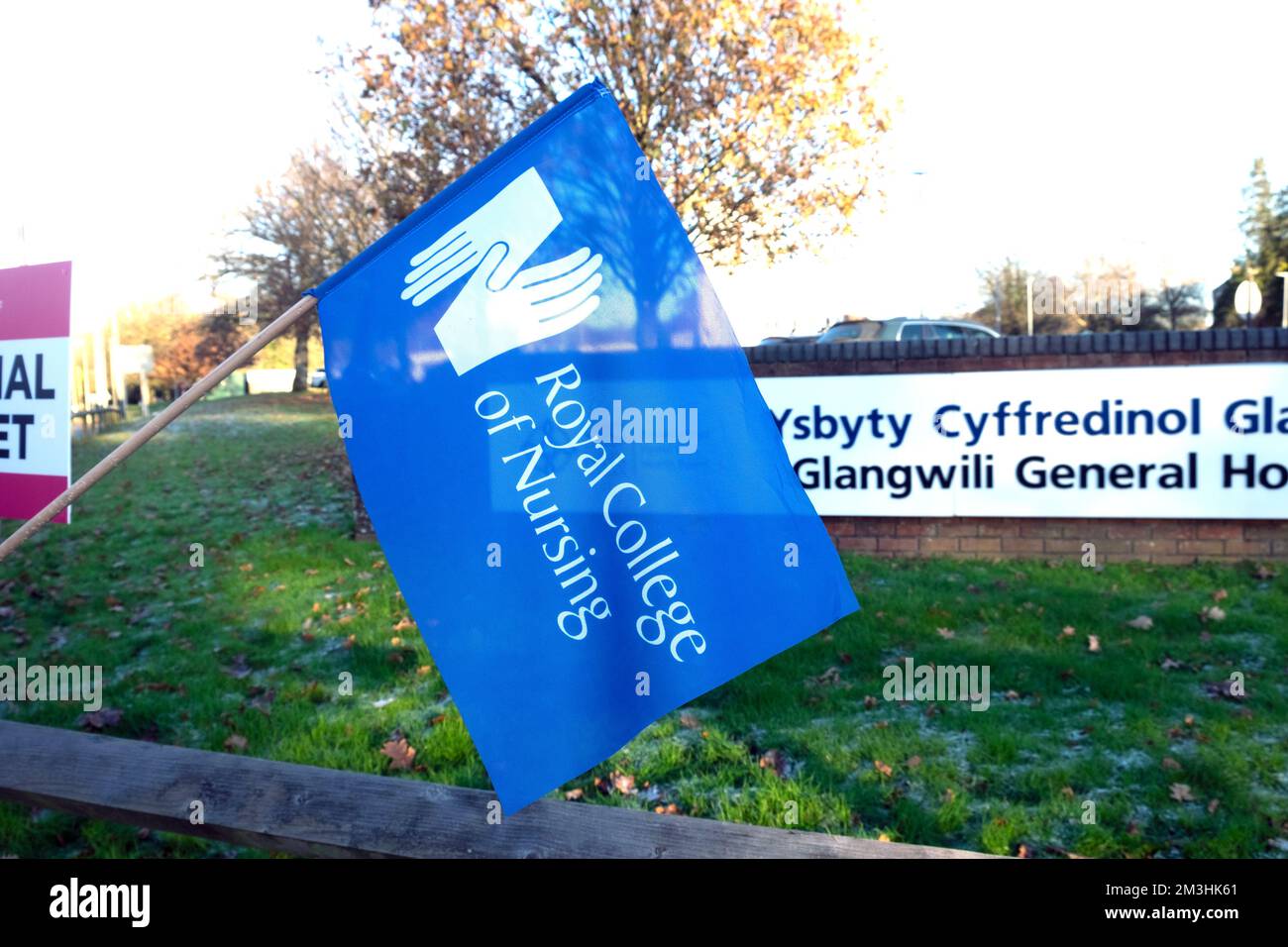 Nurses strike on picket line with protest placards stand in the cold striking outside Glangwili General Hospital Carmarthen Wales UK 16 December 2022 Stock Photo