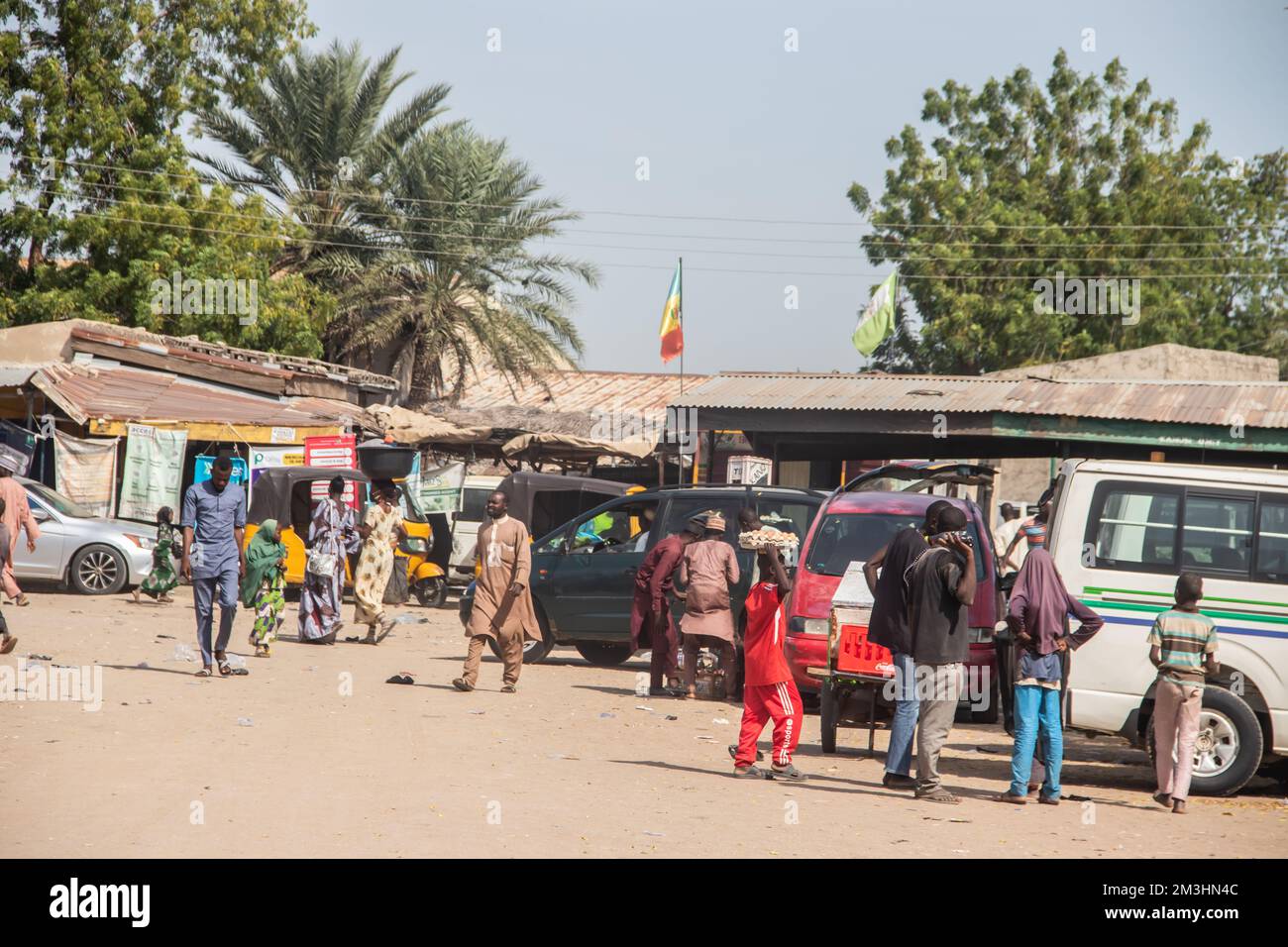 African open market at busy streets and street vendors, with busy
