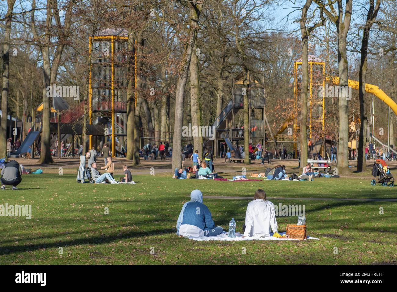 Hasselt, Limburg - Belgium - 22.02.2021 Children and parents rest together. Playground with children's attractions in the forest park. Stock Photo