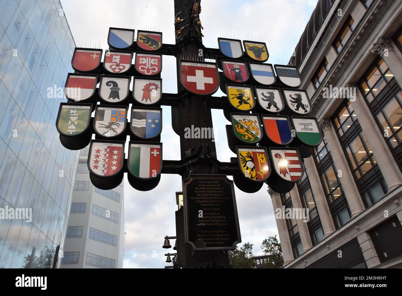 Coat of arms of 26 cantons of Switzerland exhibited in London Leicester Square in the form of tree. Stock Photo