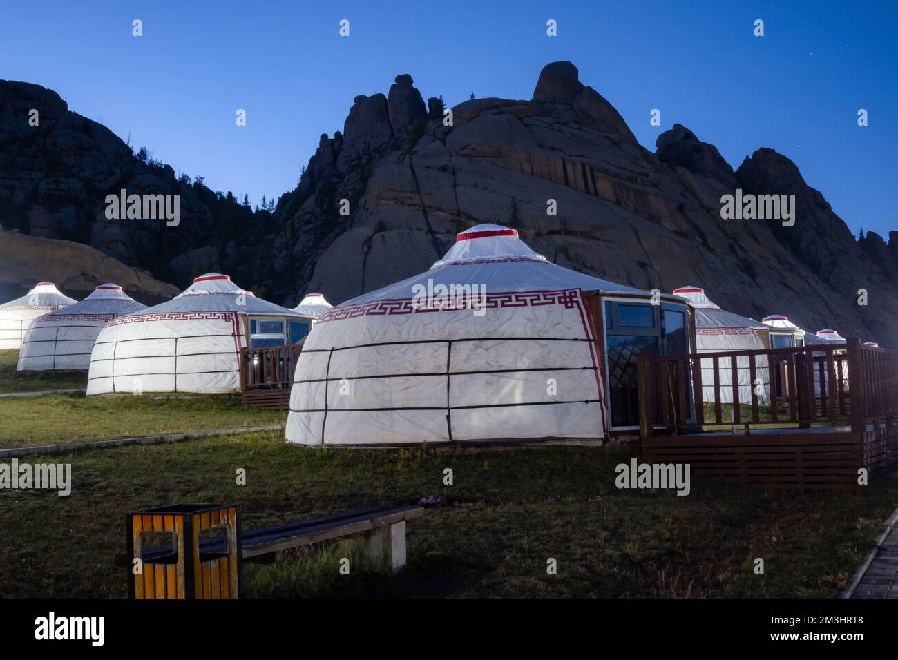 Yurt camp at night, rocky mountains in the background. Ger campsite in ...