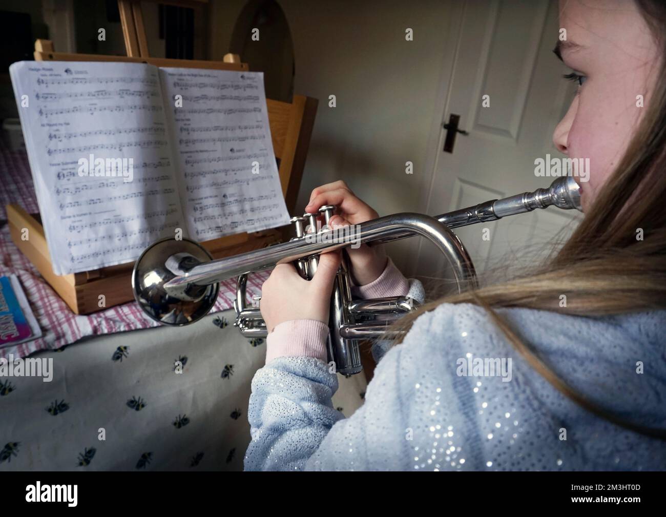 Young girl playing trumpet hi-res stock photography and images - Alamy
