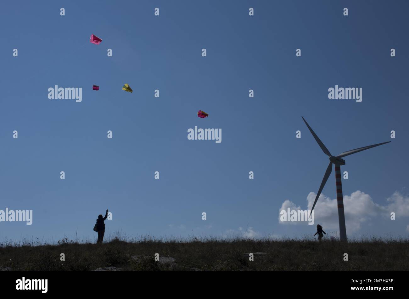 Capracotta Molise Silhouette of people having fun flying kites with