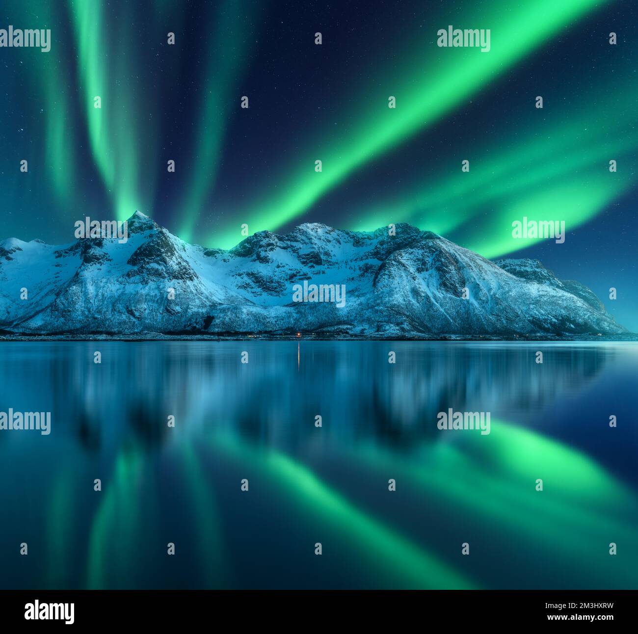 Northern lights over the mountain, sea coast, reflection in water Stock ...