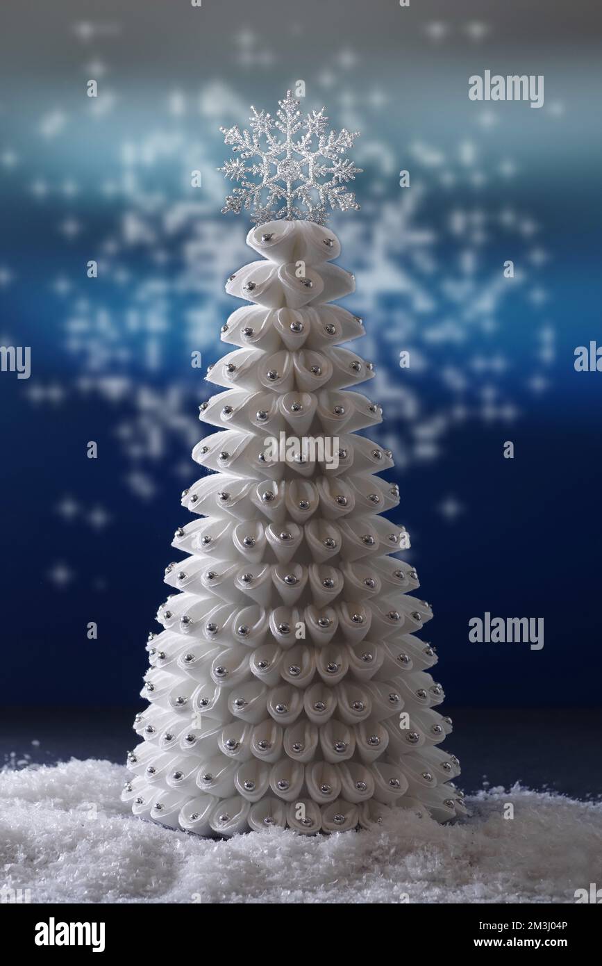 White christmas tree on blue abstract background Stock Photo - Alamy