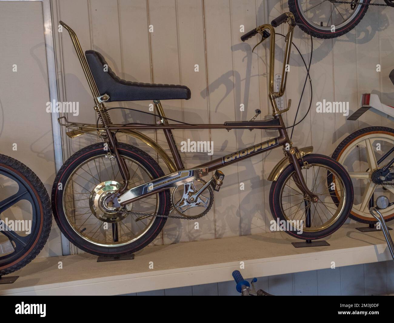 A Raleigh Chopper Gold Edition bicycle (1970s) at the Brooklands Museum, Surrey, UK. Stock Photo