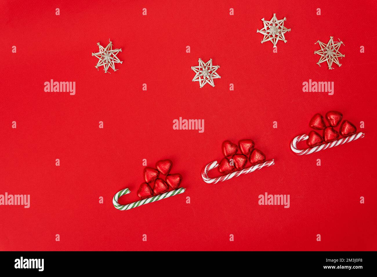 Christmas background with a sled, candy and a caramel cane Stock Photo