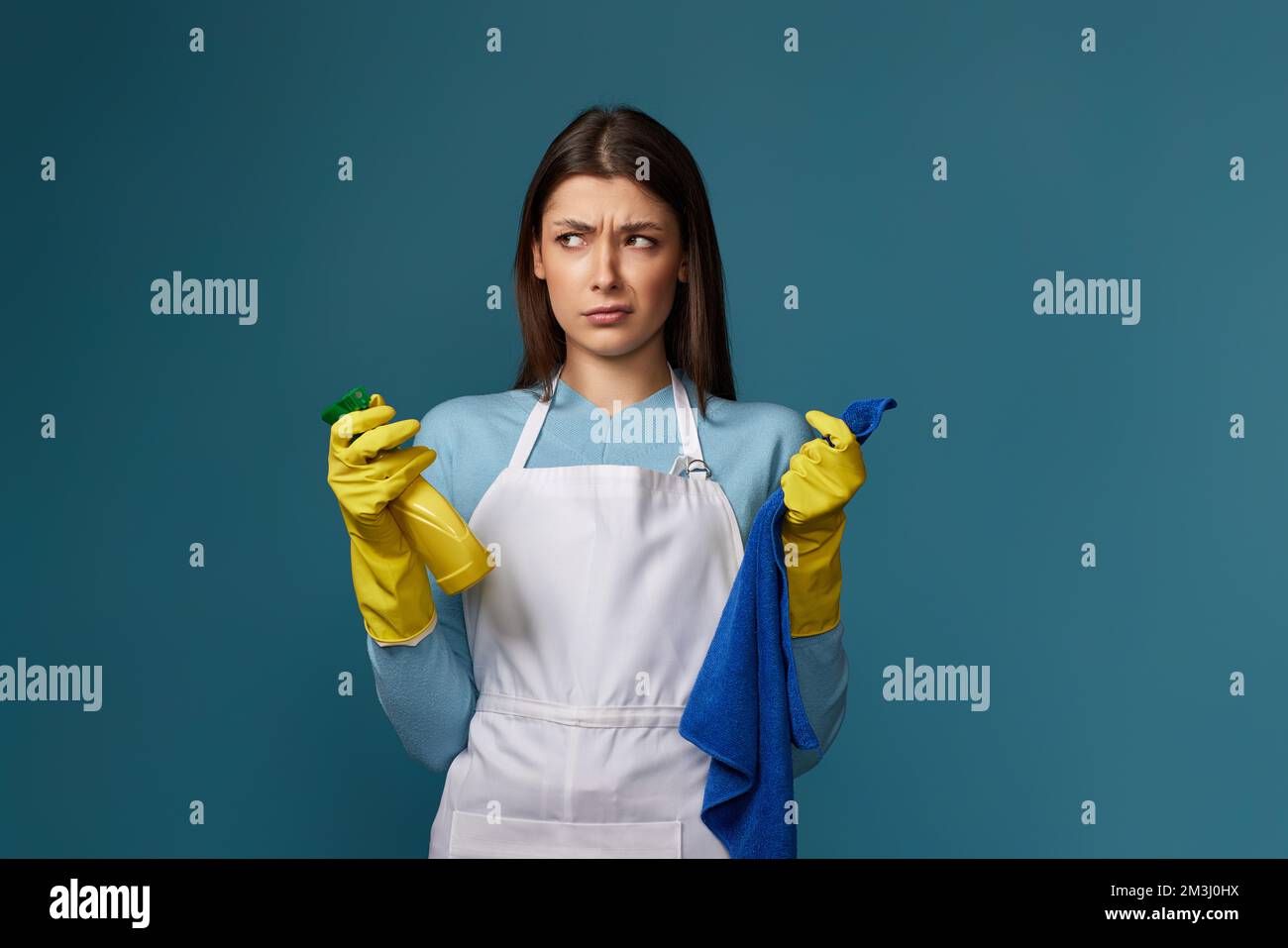 Woman in purple rubber gloves cleaning electric kettle with sponge Stock  Photo - Alamy