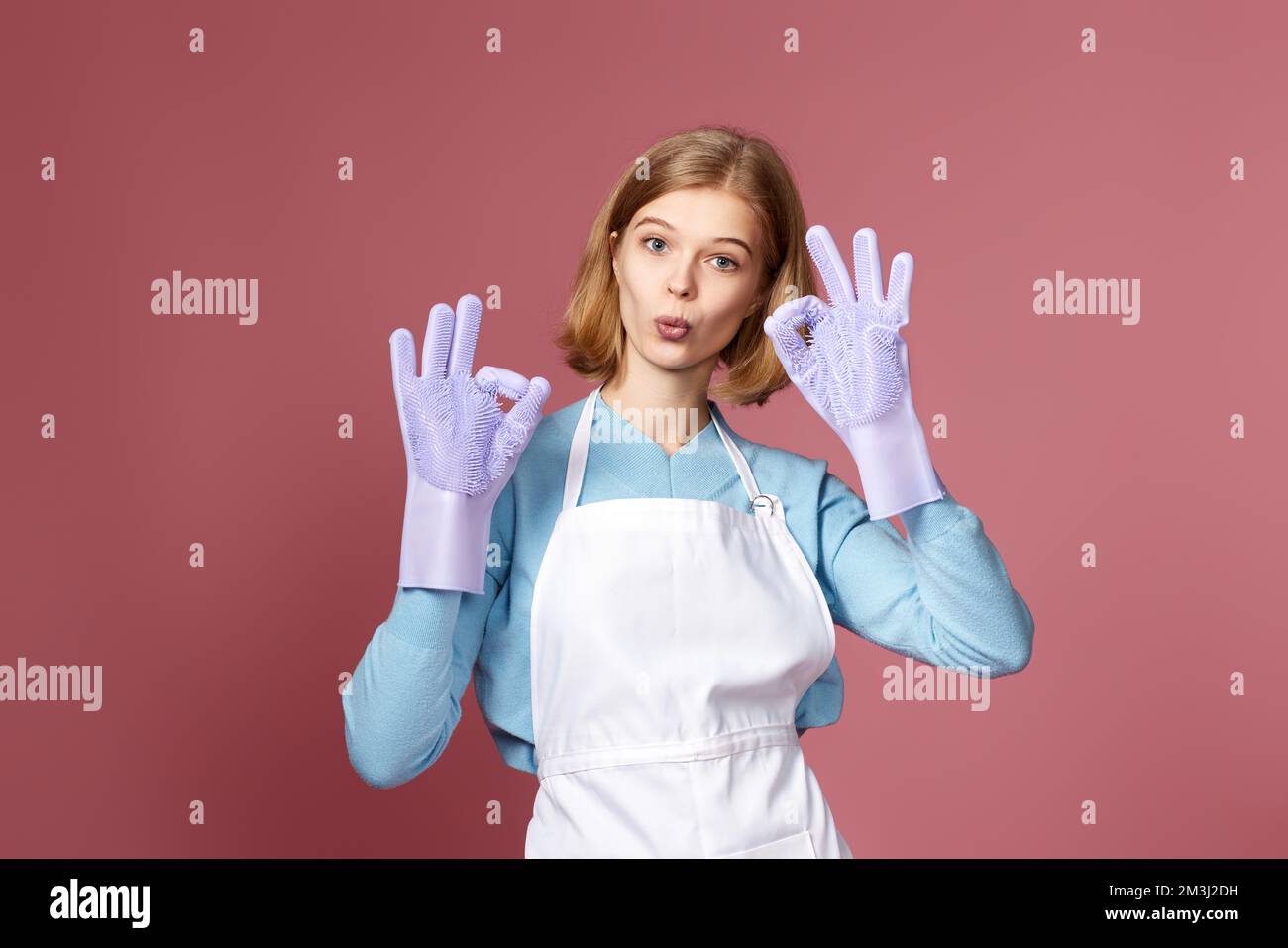woman in rubber gloves and cleaner apron showing ok sign Stock Photo ...