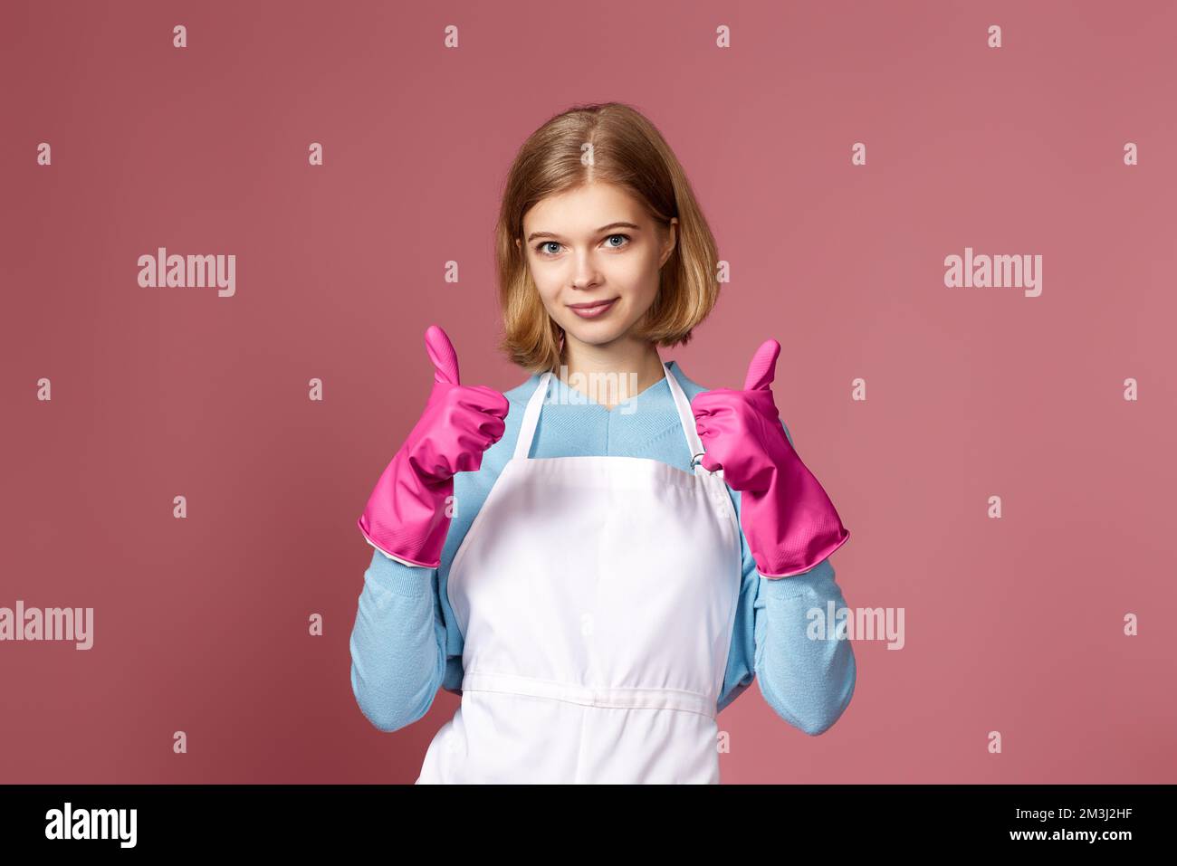 woman in rubber gloves and cleaner apron showing ok sign Stock Photo ...