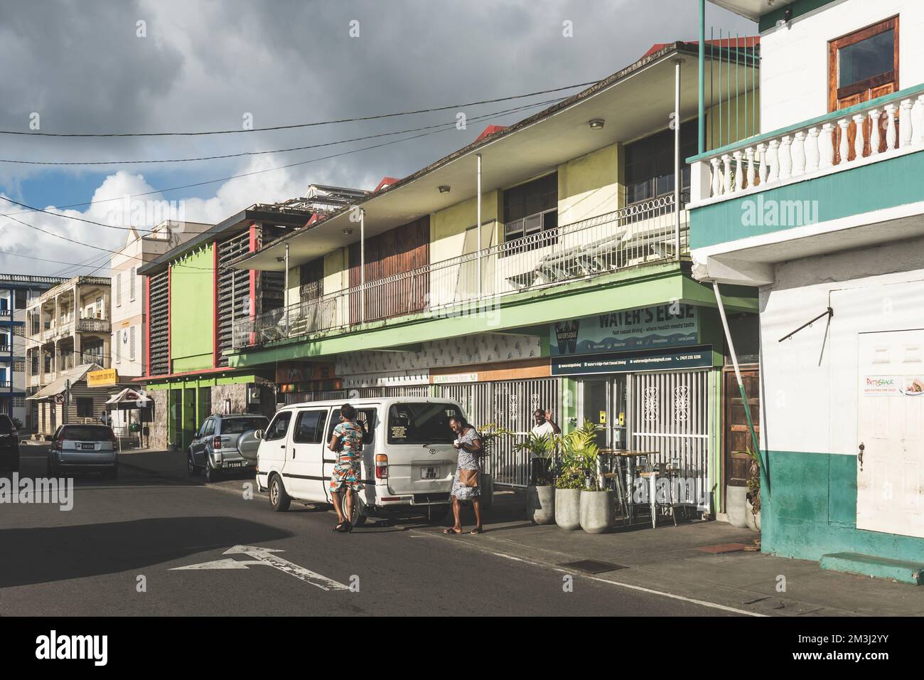 Dominica, Roseau November 12 2022 Street with restaurants and stores in capital city of