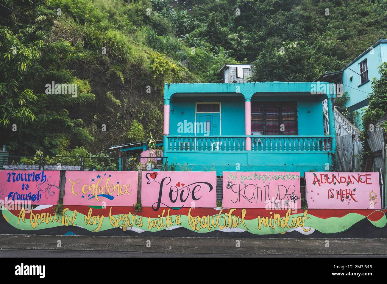Dominica, Roseau November 12 2022 positive wall messages in front of