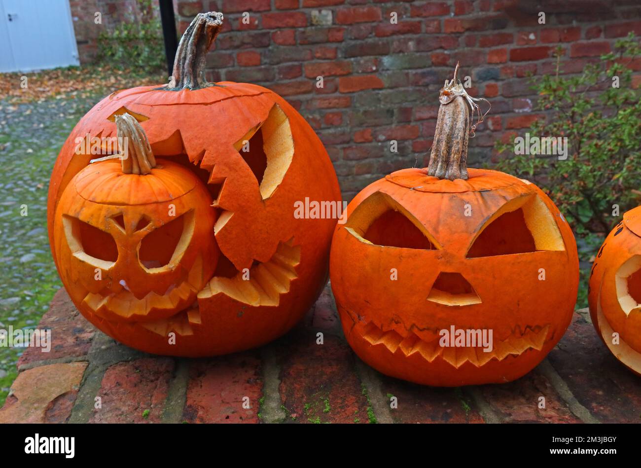 Orange Carved Halloween pumpkins, England, UK, with lights Stock Photo