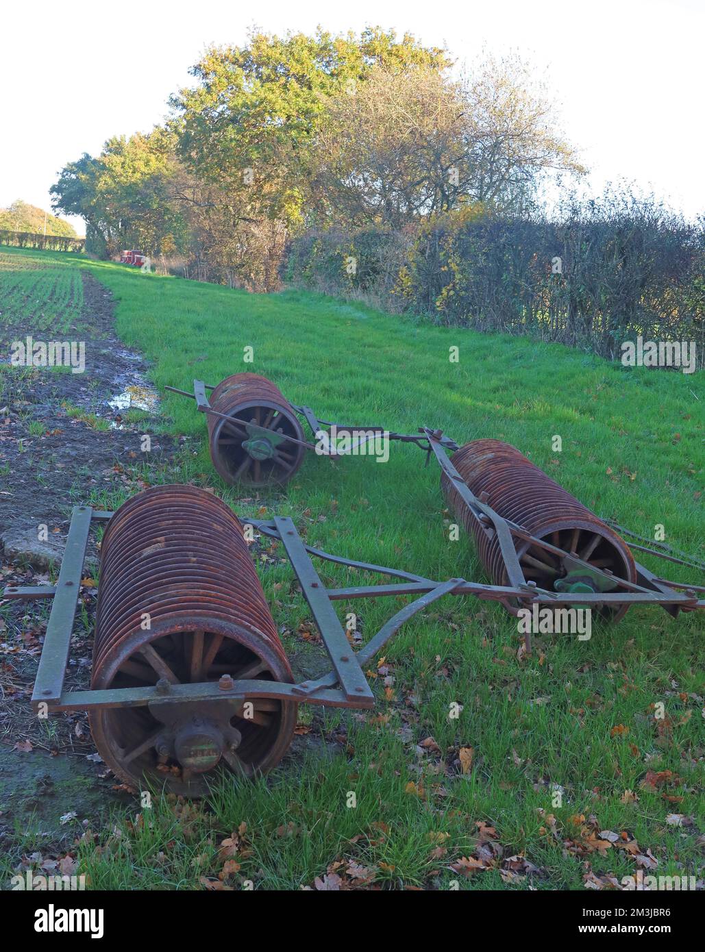 Abandoned rusty farm roller equipment, Grappenhall, Warrington, Cheshire, England, UK, WA4 4SH Stock Photo