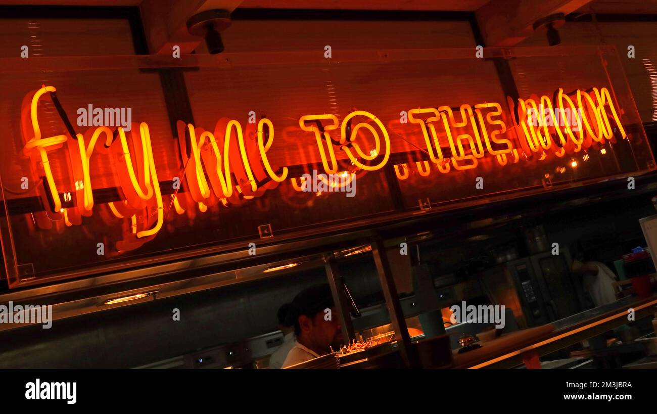 Fry Me To The Moon, neon sign, in orange, Berties Fish & Chip restaurant ,9 Victoria Street, Edinburgh, Scotland, UK, EH12HE Stock Photo
