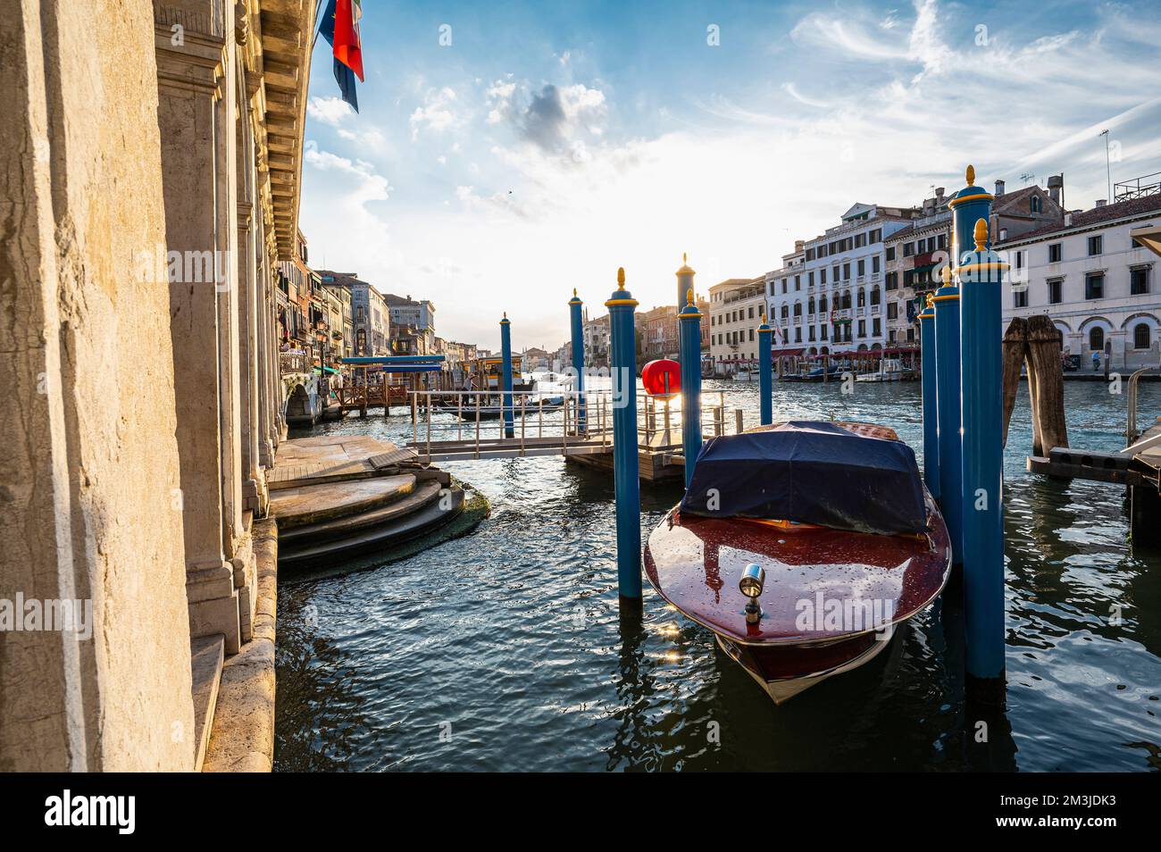 taxi boat parked close to the Rialto bridge in Venice Stock Photo