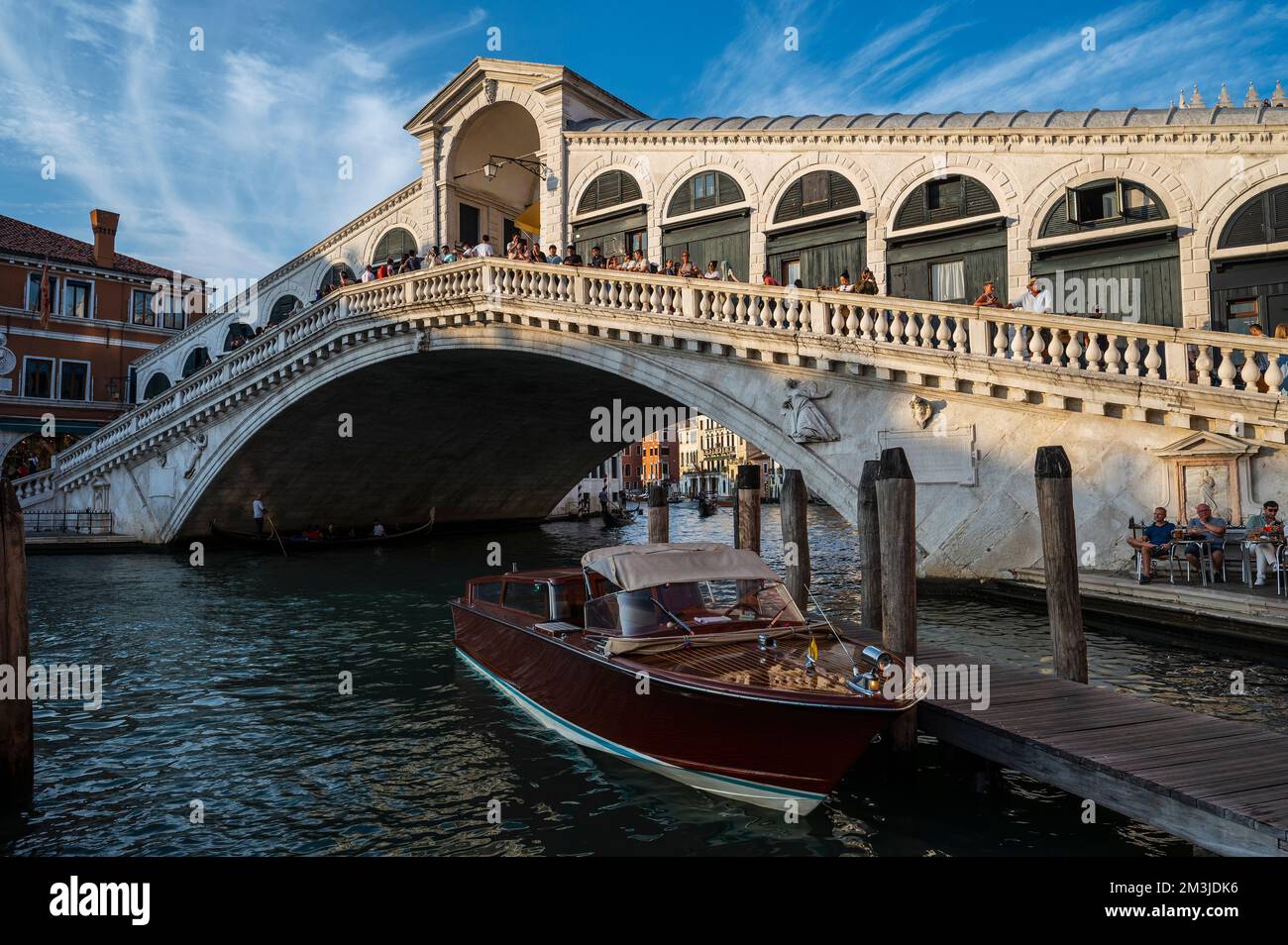 taxi boat parked at the Rialto bridge in Venice Stock Photo