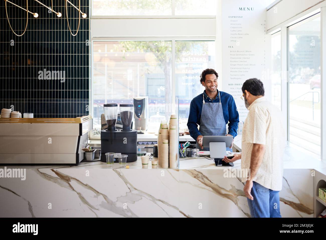 Mature male owner doing hi-res stock photography and images - Alamy