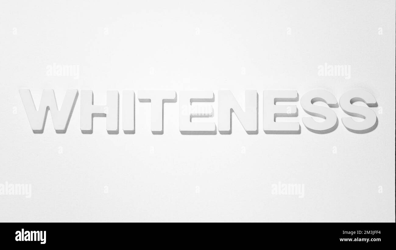Whiteness - Word by plaster moulded letters. Black and white photograph Stock Photo